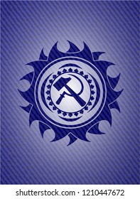 sickle and hammer icon inside jean or denim emblem or badge background