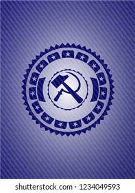 sickle and hammer icon inside jean or denim emblem or badge background