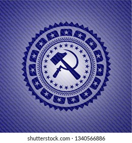 sickle and hammer icon inside jean or denim emblem or badge background