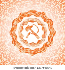 sickle and hammer icon inside orange mosaic emblem
