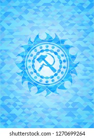 sickle and hammer icon inside realistic light blue emblem. Mosaic background