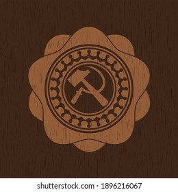 sickle and hammer icon inside realistic wooden emblem. 