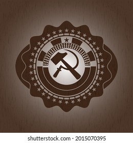 sickle and hammer icon inside realistic wood emblem. 