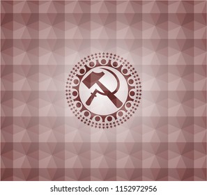 sickle and hammer icon inside red seamless geometric emblem.