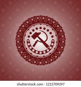 sickle and hammer icon inside red icon or emblem