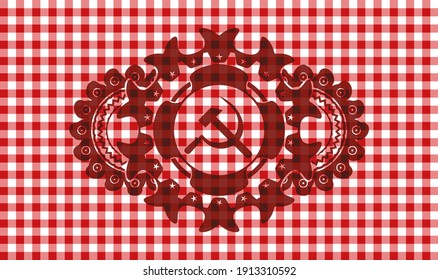 Sickle and hammer icon inside red checkered tablecloth realistic emblem. Restaurant exquisite background. Artistic illustration. 