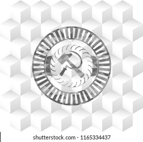sickle and hammer icon inside retro style grey emblem with geometric cube white background