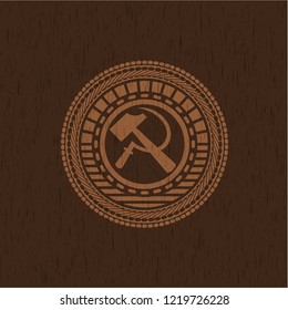 sickle and hammer icon inside retro style wooden emblem