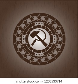 sickle and hammer icon inside retro style wooden emblem