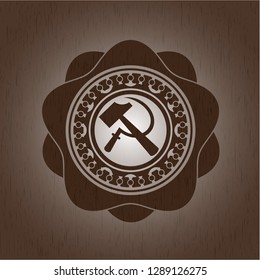 sickle and hammer icon inside retro style wood emblem