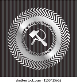 sickle and hammer icon inside silver shiny badge