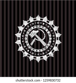 sickle and hammer icon inside silver badge