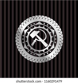 sickle and hammer icon inside silvery shiny badge