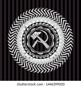 sickle and hammer icon inside silvery badge