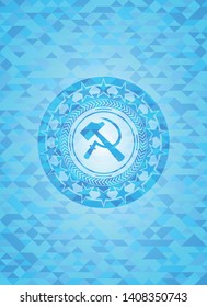 sickle and hammer icon inside sky blue emblem with mosaic background
