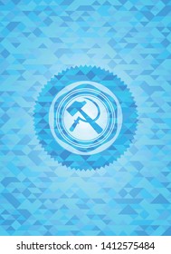 sickle and hammer icon inside sky blue emblem with mosaic background
