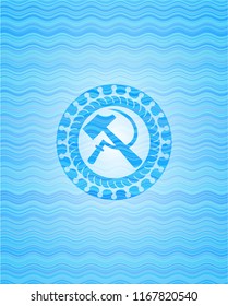 sickle and hammer icon inside water wave badge background.