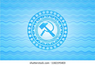 sickle and hammer icon inside water wave concept style emblem.