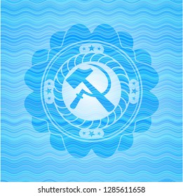 sickle and hammer icon inside water wave representation emblem.