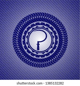 sickle icon inside badge with denim background