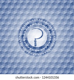 sickle icon inside blue emblem with geometric pattern.