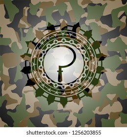 sickle icon inside camouflage emblem