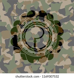 sickle icon inside camouflage texture