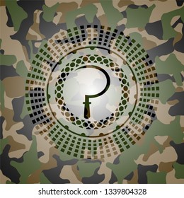 sickle icon inside camouflaged emblem