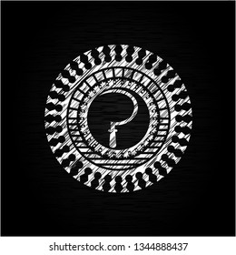 sickle icon inside chalk emblem written on a blackboard