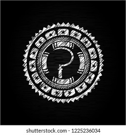 sickle icon inside chalkboard emblem on black board