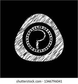 sickle icon inside chalkboard emblem written on a blackboard