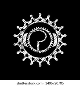 sickle icon inside chalkboard emblem written on a blackboard