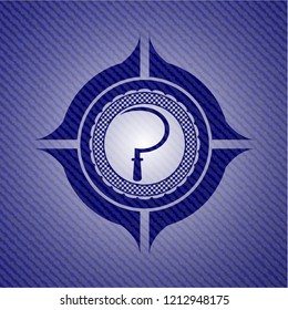 sickle icon inside emblem with denim texture