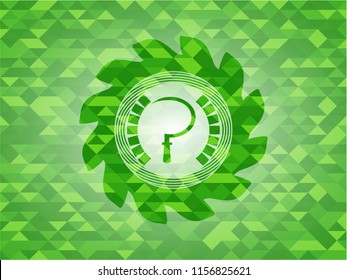 sickle icon inside green emblem with triangle mosaic background