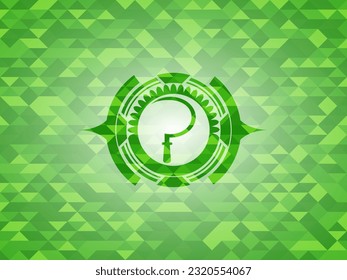 sickle icon inside green emblem with triangle mosaic background. 