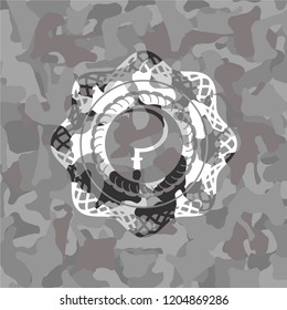 sickle icon inside grey camouflage emblem