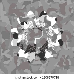 sickle icon inside grey camouflage texture