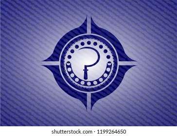 sickle icon inside jean or denim emblem or badge background