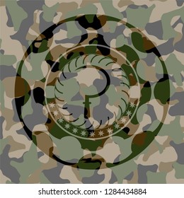 sickle icon on camouflaged texture