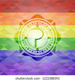 sickle icon on mosaic background with the colors of the LGBT flag