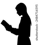 Side profile portrait silhouette of standing teenage girl reading a book