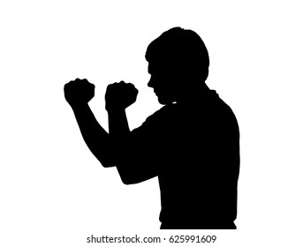 Side profile portrait silhouette of a teenage boy in aggressive boxing stance 