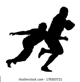 Side Profile of Rugby Player Tackling Runner With Ball Silhouette