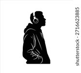 Side profile silhouette of young man wearing hoodie and headphones, hands in pockets. Casual urban style, listening to music. Isolated on white.