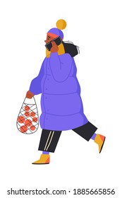 Side View of a Black Young Woman Walking Forward talking on smartphone with fruit bag in her hand. Isolated on white background. Cartoon style. Vector illustration