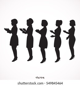 Side view of clapping women standing together against,  applause of the public after show. 