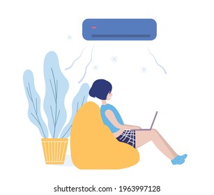 sideview girl sitting on couch and using laptop