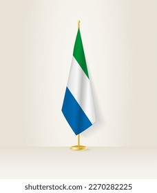 Bandera de Sierra Leona en un puesto de bandera. Ilustración vectorial.