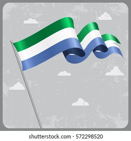 Sierra Leone flag wavy abstract background. Vector illustration.