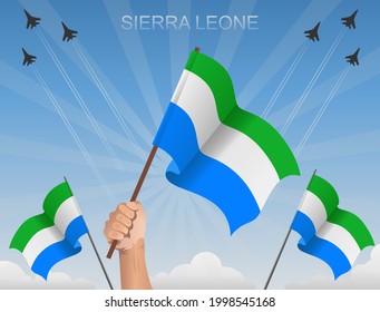 Sierra Leone flags fluttering under the blue sky